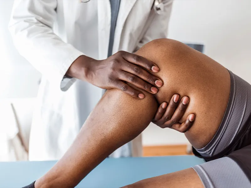 Doctor Examing a patient's knee